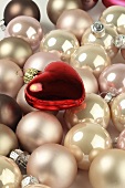 Pink Christmas baubles and a red heart