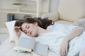 Woman asleep with book