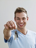 A man holding keys