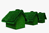 Grass covered houses in a row