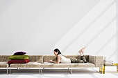 A Japanese woman relaxing on a sofa