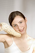 Young woman with a sisal glove
