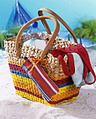 Beach bag with bottle of water, swimsuit & mobile phone bag