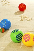Coloured balls in sand