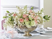 Romantic flower arrangement in a silver bowl