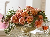 Arrangement of roses in silver bowl