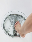 Woman on scales (foot)