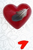 Red heart with feather