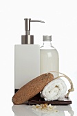 Liquid soap, pumice stone and towel