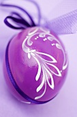 Painted purple Easter egg to hang up