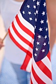 Woman holding American flag (4th of July, USA)