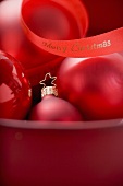 Red Christmas baubles with ribbon