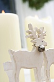 Christmas decoration: white candles and reindeer
