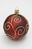 Red Christmas bauble with gold decoration