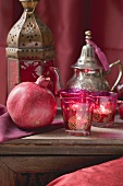 Middle Eastern decorations: pomegranate, windlights, teapot