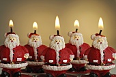 Several Father Christmas candles