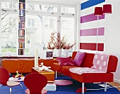 Colourful living room with bookshelves by window and TV