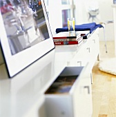 Picture and books on a sideboard in a living room