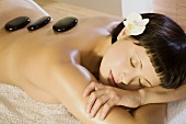 Young woman in spa, receiving lastone therapy