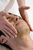 Man receiving facial massage