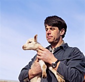 Man holding a lamb