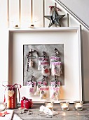 Small advent calendar bags in a picture frame
