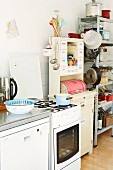 Cooker & utensils on shelves in students' kitchen