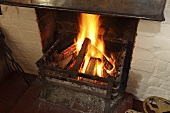 A fire burning in an old-fashioned fireplace