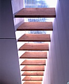 View of wooden board construction below a skylight in the ceiling