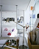 Artist's or architect's work space with stainless steel desk lamps beside with construction materials used for model making