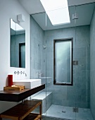 Contemporary bathroom with glass shower stall (at floor level)