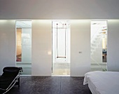 View of swing through stairwell window of designer bedroom