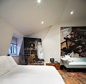 Bedroom with double bed and pictures on the walls