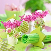 Easter table decorations with hyacinths flowers and chick figures