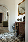 Collection of antique urns in hallway