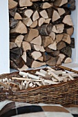 Firewood, stack and in a basket in a living room
