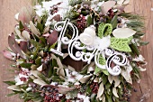 A green and white Christmas wreath