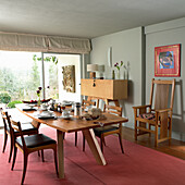 Dining room with wooden furniture and art on the wall