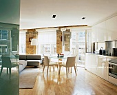 Dining area and kitchen in open-plan, modernised living space