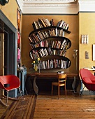 Mix of styles in traditional living room with curved designer bookcase above postmodern table