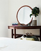 Round mirror on wooden console table