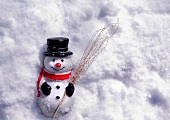 Ornamental snowman in snow