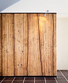 Illuminated wall of rustic wooden planks
