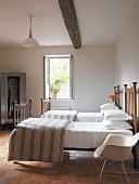 Single beds in rustic bedroom