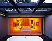 View into illuminated bedroom