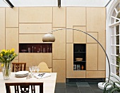 Dining room with curved standard lamp