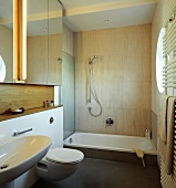 Bathroom with shower tub, sink, toilet & mirror
