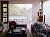 Living room with sofa, chaise longue & coffee table