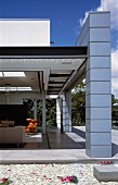 Tiled veranda & living room with open sliding door