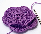 Crocheting a purple flower